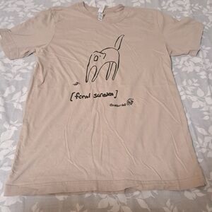 Beige Graphic T-Shirt with Feral Screaming Cat Design by Catscribs